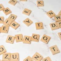 pexels-photo-18512928-18512928 Scattered wooden alphabet tiles on a marble surface spelling 'BINGO'. Perfect for board game themes.